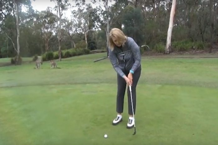 Anne Rollo putting tip club under armpits womensgolf.com