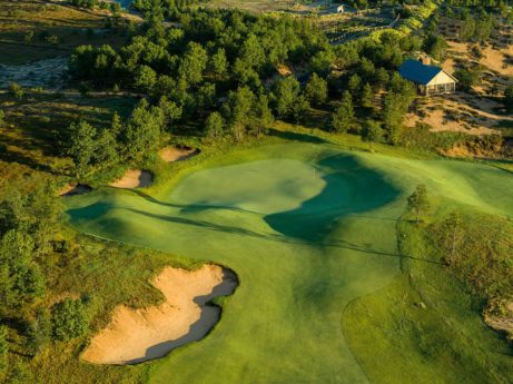 17th Hole, Sand Valley “Punchbowl” with the Coore & Crenshaw cabin in the upper right hand corner.