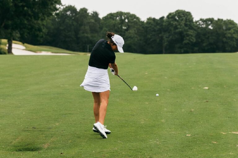 woman golfer hitting fairway wood - Womens Golf